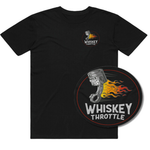 Black t-shirt featuring a small logo on the chest and a larger, circular graphic with the text "Whiskey Throttle" and an illustrated piston on fire.